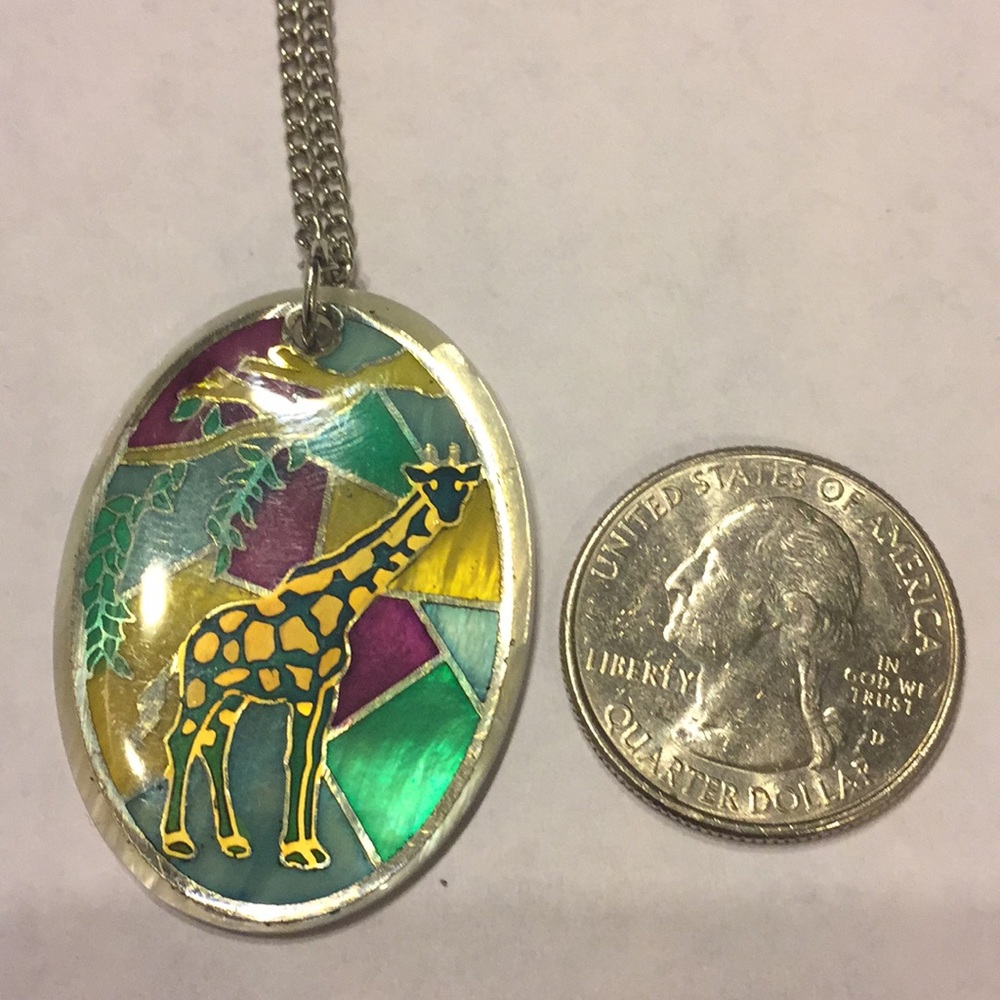 Giraffe necklace on silver tone chain